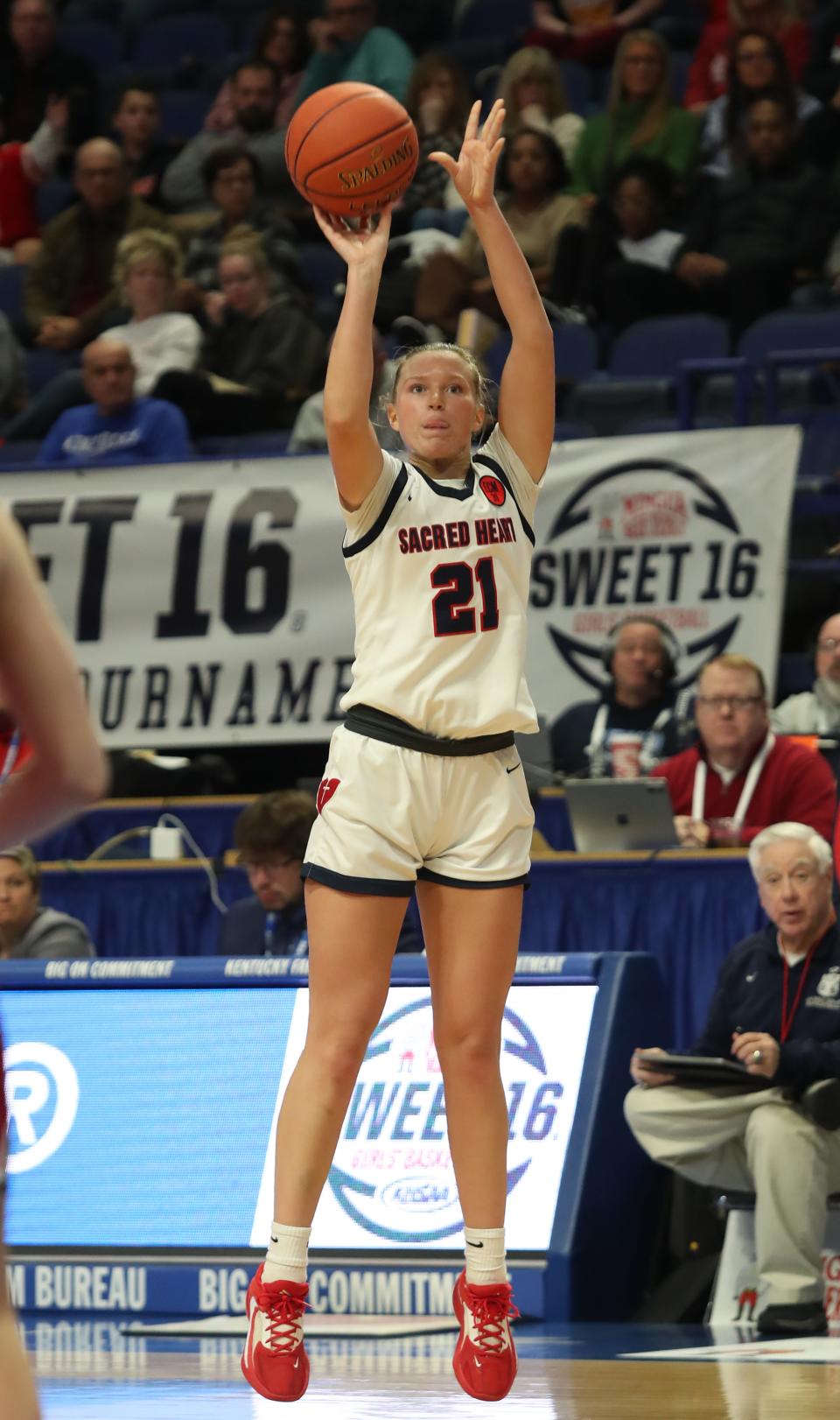 Sacred Heart’s Reagan Bender makes a three against George Rogers Clark in the 2023 Mingua Beef Jerky Girls’ Sweet 16.March 11, 2023