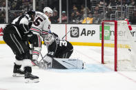 Chicago Blackhawks right wing Joey Anderson (15) scores against Los Angeles Kings goaltender Cam Talbot (39) during the third period of an NHL hockey game Thursday, April 18, 2024, in Los Angeles. (AP Photo/Ashley Landis)