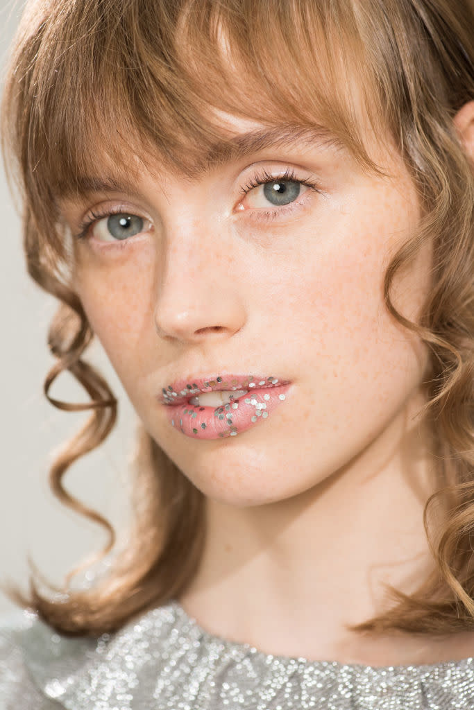 <p>At Shrimps, they used large glitter pieces to embellish lips. Who needs jewellery when you’ve got lip gems?<br>[Photo: Getty] </p>
