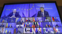 European Council President Charles Michel, top screen left, takes part in an EU Summit, via videoconference link, at the European Council building in Brussels, Thursday, Feb. 25, 2021. European Union leaders are gathering Thursday, via videoconference link, to try to inject new energy into the 27-nation bloc's lagging coronavirus vaccination effort as concern mounts that new variants might spread faster than authorities can adapt. (Olivier Hoslet, Pool via AP)