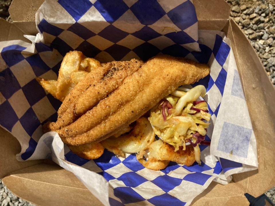 An order of catfish and fries from Ashleigh Shanti's, Good Hot Fish, served at a pop-up event at Burial Beer Co. in 2022.