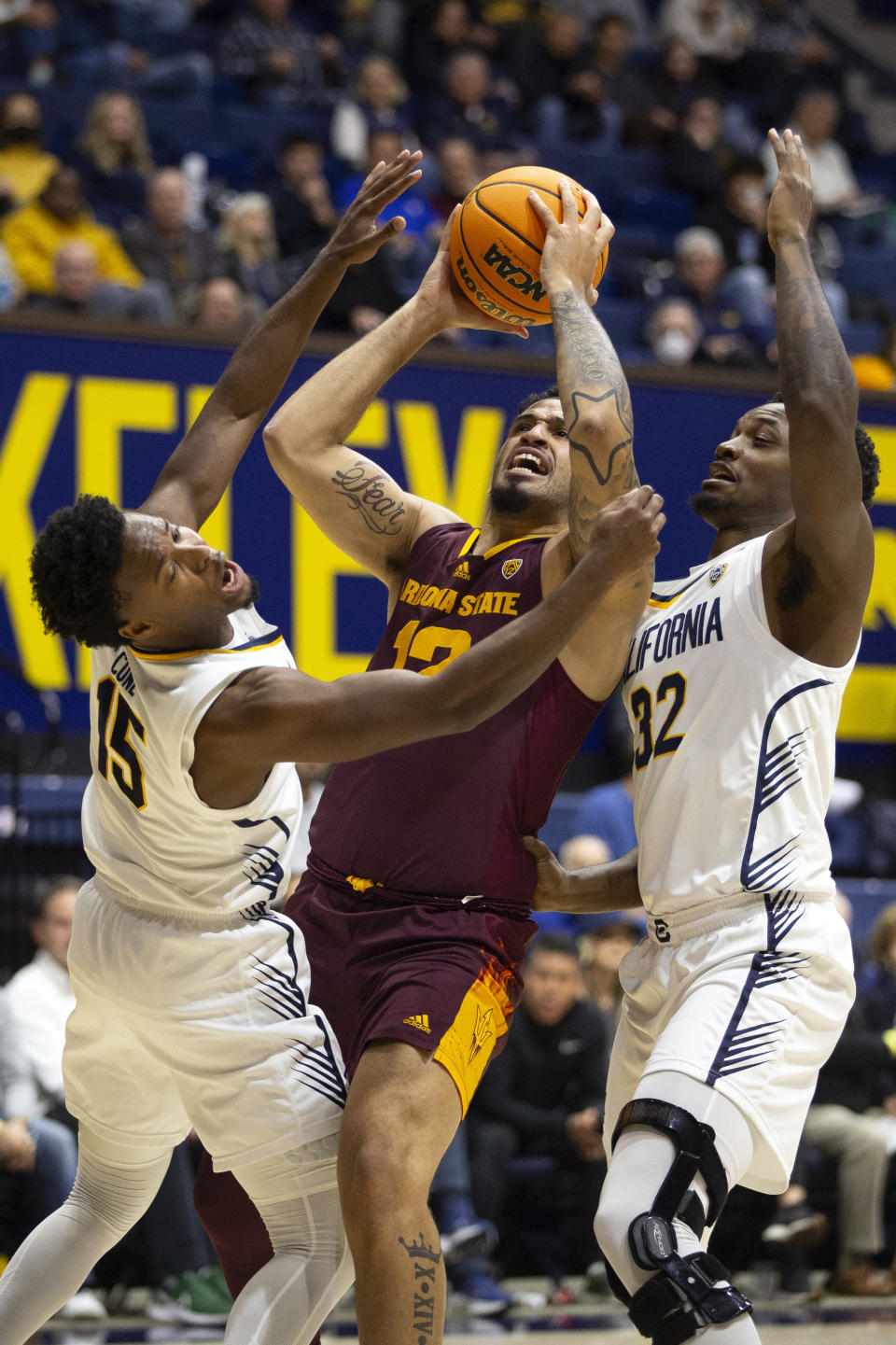 Arizona State guard Jose Perez, center, goes up to shoot between California defenders Jalen Cone (15) and Jalen Celestine (32) during the first half of an NCAA college basketball game, Sunday, Dec. 31, 2023, in Berkeley, Calif. (AP Photo/D. Ross Cameron)