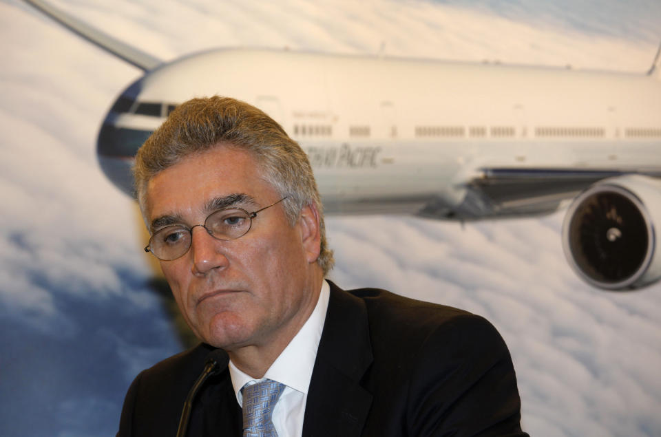 Cathay Pacific Airways Chairman Christopher Pratt reacts as he attends a press conference for the airline's annual results in Hong Kong Wednesday, March 14, 2012. Cathay Pacific Airways, Hong Kong's biggest airline, says profit fell 61 percent last year, hurt by persistently high jet fuel prices and weakness in the world's major economies. The airline posted a profit of 5.5 billion Hong Kong dollars ($709 million) for 2011, down from a record HK$14 billion the year before. Earnings per share fell to HK$1.40 from HK$3.57. (AP Photo/Vincent Yu)