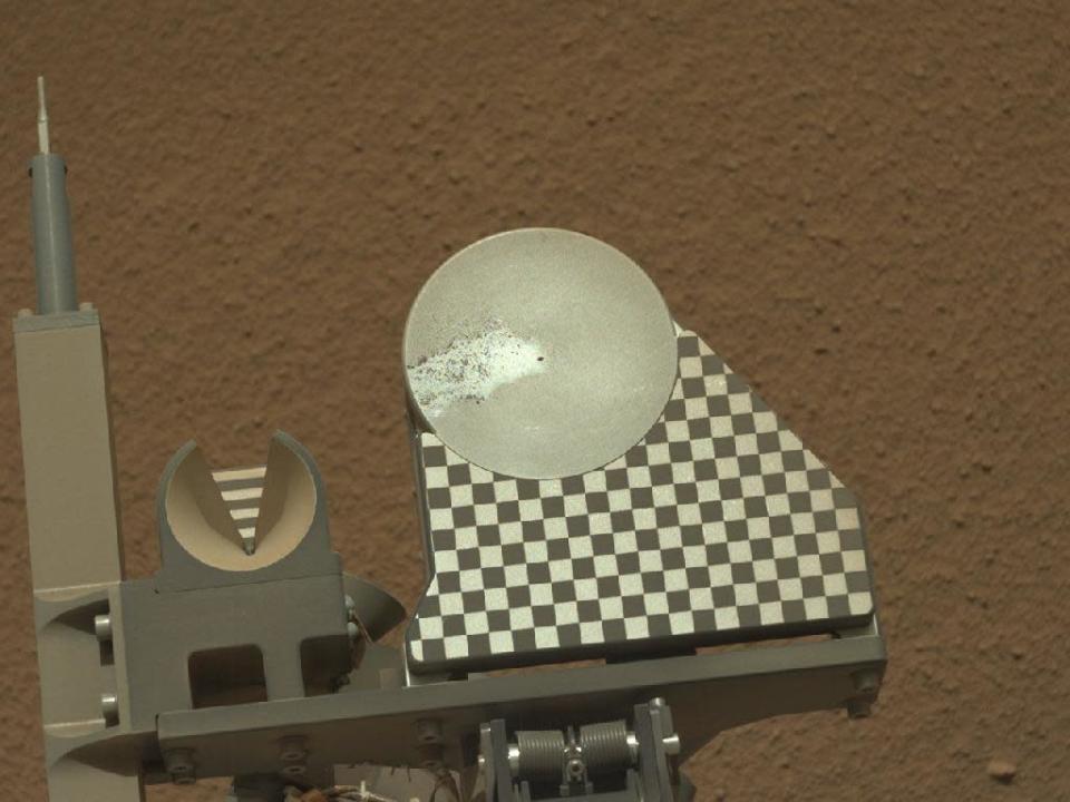 The robotic arm on NASA's Mars rover Curiosity delivered a sample of Martian soil to the rover's observation tray for the first time during the mission's 70th Martian day, or sol (Oct. 16, 2012). This image taken later that same sol by the rover's left Mast Camera shows the sample on the tray. The tray is 3 inches (7.8 centimeters) in diameter. (NASA)