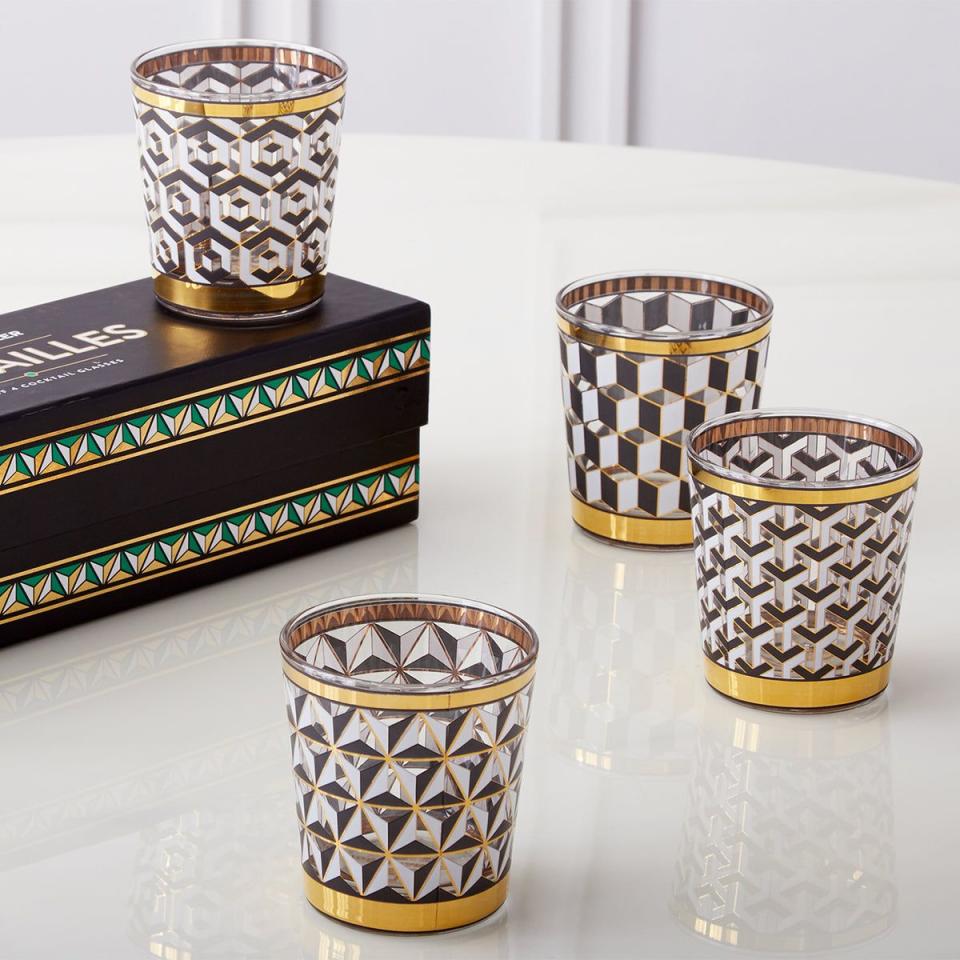 <p><strong>Jonathan Adler</strong></p><p>jonathanadler.com</p><p><strong>$134.00</strong></p><p><a href="https://go.redirectingat.com?id=74968X1596630&url=https%3A%2F%2Fjonathanadler.com%2Fproducts%2Fversailles-glassware-set%3Fvariant_id%3D31498400858146&sref=https%3A%2F%2Fwww.elledecor.com%2Fshopping%2Fhome-accessories%2Fg39491313%2Fbest-bar-accessories%2F" rel="nofollow noopener" target="_blank" data-ylk="slk:Shop Now;elm:context_link;itc:0" class="link ">Shop Now</a></p><p>Jonathan Adler has the Midas touch when it comes to injecting a bit of Hollywood glamour into everyday objects: Witness his Versailles glassware, with metallic black, white, and gold details. Sold as a set of four.</p>