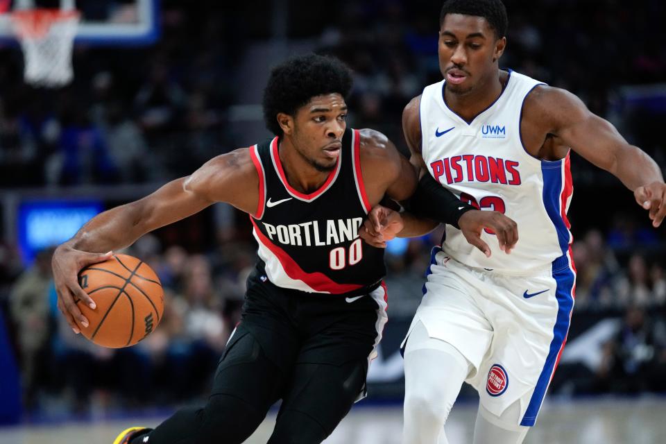 Portland Trail Blazers guard Scoot Henderson (00) drives on Detroit Pistons guard Jaden Ivey (23) in the first half at Little Caesars Arena in Detroit on Wednesday, Nov. 1, 2023.