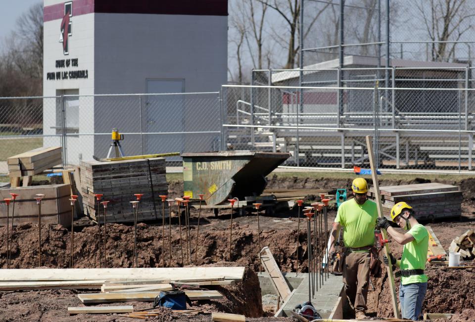 Construction is under way as C.D. Smith Construction employees work on the concessions stand/restaurant building located next to the baseball field at Fond du Lac High School Wednesday, April 12, 2023, in Fond du Lac, Wis. Dan Powers/USA TODAY NETWORK-Wisconsin. 