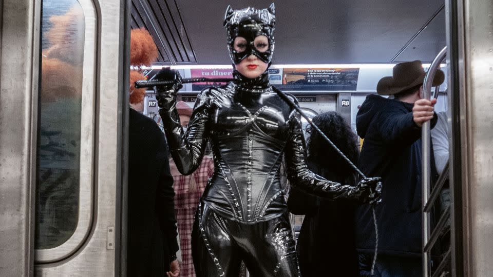 Catwoman stands clear of the closing doors. - Seymour Licht