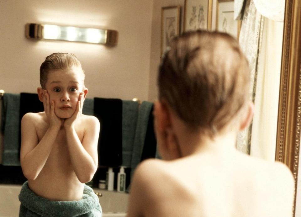 Macaulay Culkin played eight-year-old Kevin, who is left behind in his Chicago home when his family go on holiday to Paris in ‘Home Alone’ (Rex)