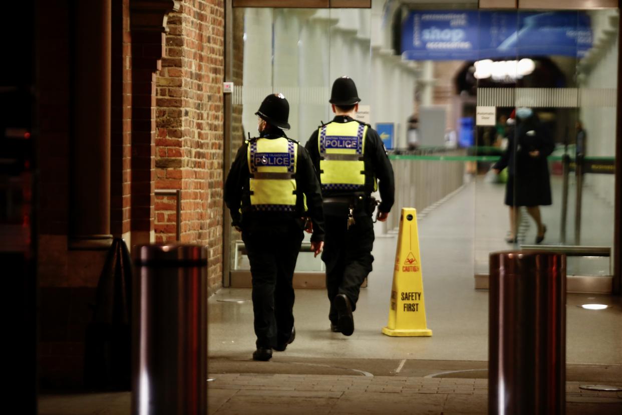 LONDON, UNITED KONGDOM - DECEMBER 20: Police officers patrol at St Pancras International train station in London, United Kingdom on December 20, 2020. several European countries ban travel to and from the UK due to fears over the emergence of a new variant of coronavirus. Large parts of south-east England, including London, are now under a new, stricter level of restrictions to curb the spread of the virus during the upcoming holiday season. (Photo by Hasan Esen/Anadolu Agency via Getty Images)