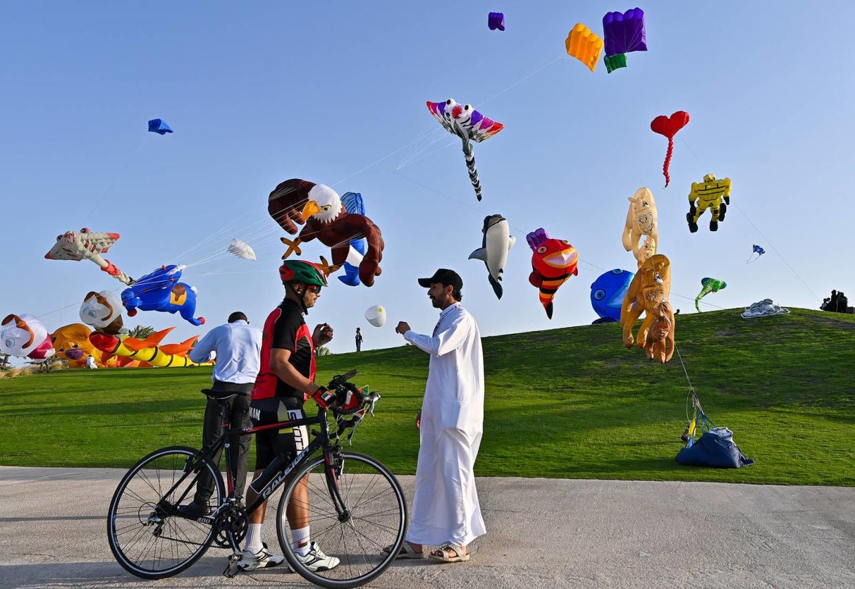 Kites fly in the air during the inaugural day of the 2023 Qatar Kite Festival at the Museum of Islamic Art (MIA) Park in Doha, Qatar, on March 16, 2023. 