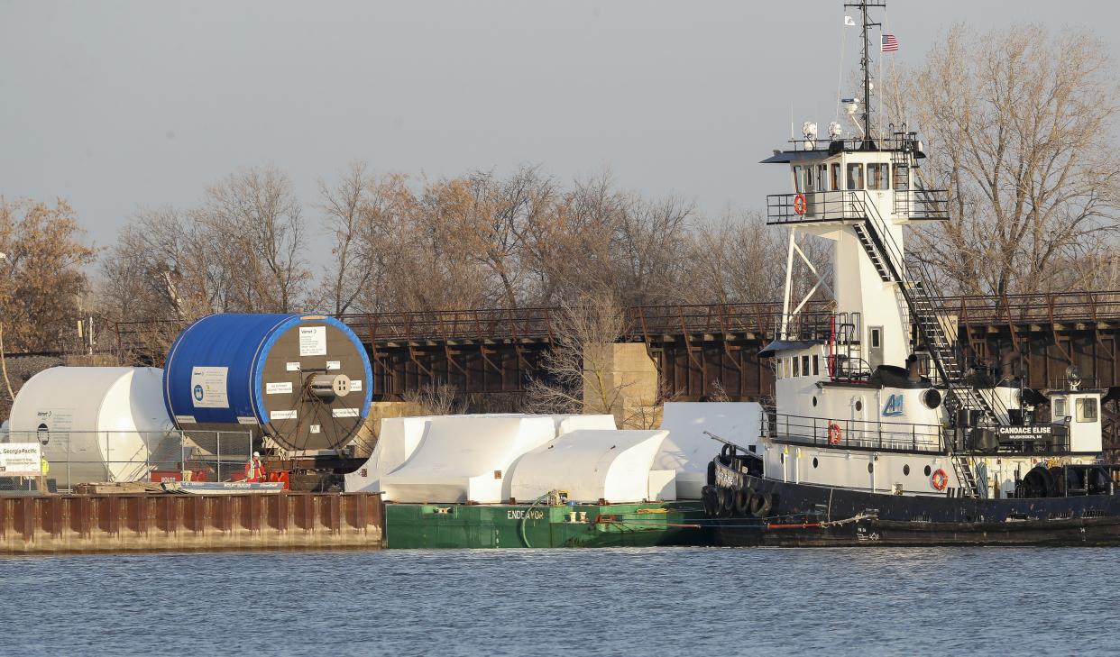 A barge docked on Friday at the Georgia-Pacific Broadway Mill in Green Bay. The barge delivered a Yankee dryer, TAD dryers and hoods for the mill's Brawny expansion project.