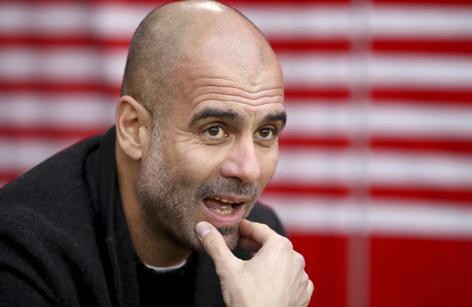 Manchester City manager Pep Guardiola looks out prior to the match against Southampton, during their English Premier League soccer match at St Mary's Stadium in Southampton, England, Sunday Dec. 30, 2018. (Adam Davy/PA via AP)