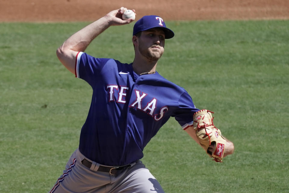 Texas Rangers starting pitcher Kyle Cody throws to a Los Angeles Angels batter during the first inning of a baseball game in Anaheim, Calif., Sunday, Sept. 20, 2020. (AP Photo/Alex Gallardo)