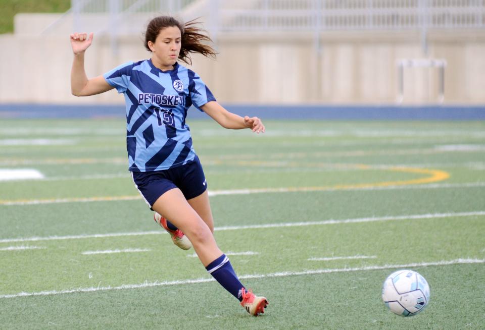Petoskey's Alaina Anderson chases down the ball during the first half against Alpena.