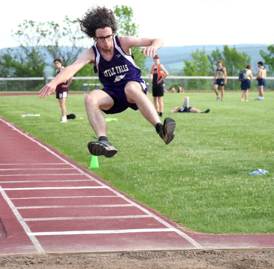 Little Falls Mountie Daniel Ressue competes in the triple jump at Section III's Class B2 championship meet Thursday. Ressue won the event at his home track in Little Falls.