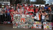 Fans brandish tributes to their favourite players from the grand final teams. Pic: Getty