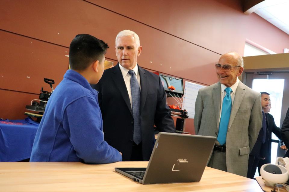 Former Vice President Mike Pence asks eighth grader Elder Rapalo about a 3D printing project he worked on recently in his school's new makerspace at Career Academy South Bend. Pence visited the school on Thursday, May 25, 2023.