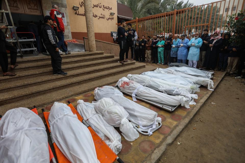 People mourn as they collect the bodies of Palestinians killed in an airstrike on December 5, 2023 in Khan Yunis, Gaza. (Photo by Ahmad Hasaballah/Getty Images)