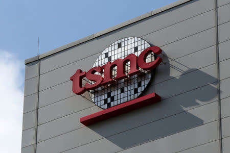 FILE PHOTO A logo of Taiwan Semiconductor Manufacturing Co (TSMC) is seen on a wall of its headquarters in Hsinchu, Taiwan October 5, 2017. REUTERS/Eason Lam/File Photo
