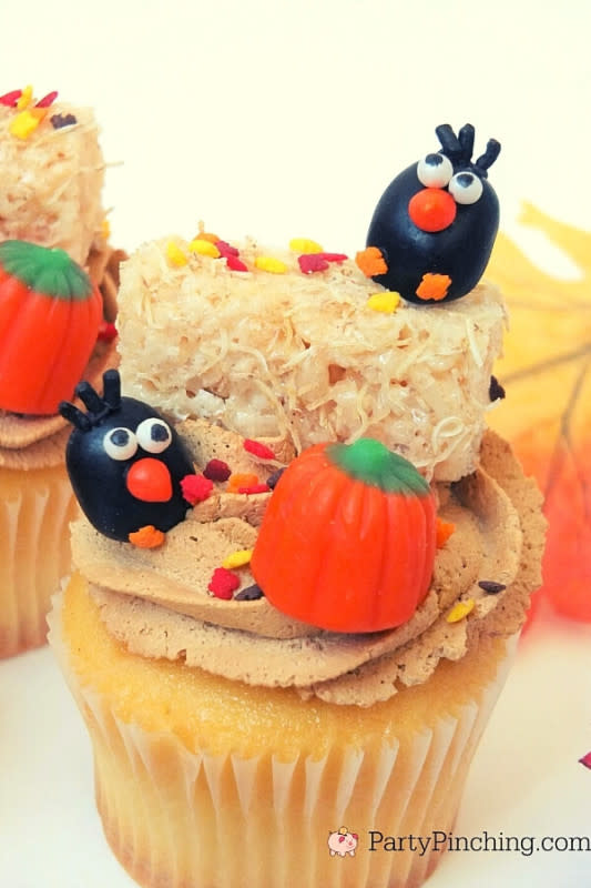<p>Party Pinching</p><p>Too-cute cupcakes with crows, rice Krispie treats and pumpkins!</p><p><strong>Get the recipe:</strong> <a href="https://partypinching.com/adorable-autumn-crow-cupcakes/" rel="nofollow noopener" target="_blank" data-ylk="slk:Adorable Autumn Cupcakes;elm:context_link;itc:0;sec:content-canvas" class="link rapid-noclick-resp"><strong>Adorable Autumn Cupcakes</strong></a></p>