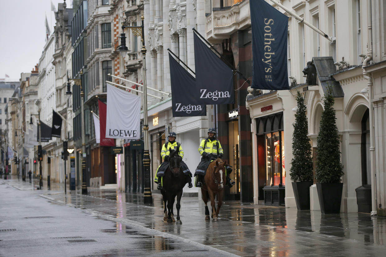 LONDON, ENGLAND - JANUARY 16: Mounted police pass luxury shops on New Bond Street in Mayfair on January 16, 2021, in London, England. With a surge of COVID-19 cases fuelled partly by a more infectious variant of the virus, British leaders have reimposed nationwide lockdown measures across England through at least mid February. (Photo by Hollie Adams/Getty Images)