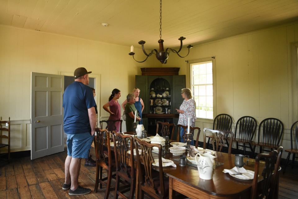 A docent speaks to guests at Blount Mansion, the home of William Blount, a signer of the U.S. Constitution, during the Knoxville Historic House Museums' Statehood Day celebration, Saturday, June 3, 2023.