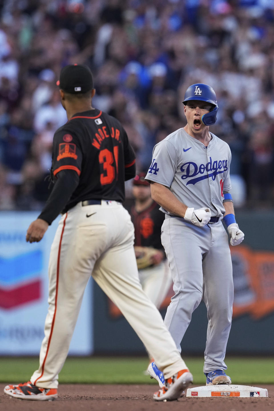 Los Angeles Dodgers' Will Smith, right, reacts after hitting a two-run double against the San Francisco Giants during the 11th inning of a baseball game Saturday, June 29, 2024, in San Francisco. (AP Photo/Godofredo A. Vásquez)