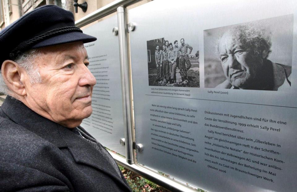 Solomon Perel inspects a memorial tablet in his honour at the Volkswagen car factory where he had worked as an apprentice - Peter Steffen/EPA/Shutterstock