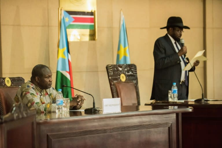 South Sudan President Salva Kiir (right) delivers a statement as former rebel leader and new vice-president Riek Machar listens during a ceremony at the Presidential House in Juba