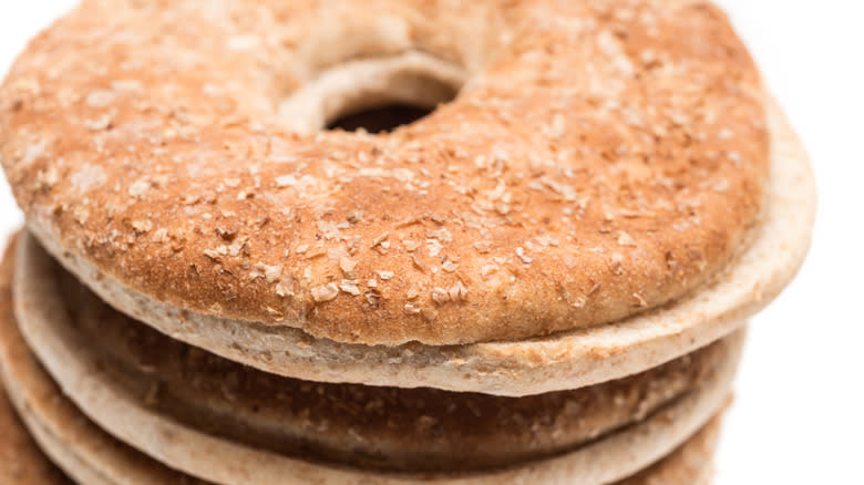Closeup of a stack of untoasted flat bagels