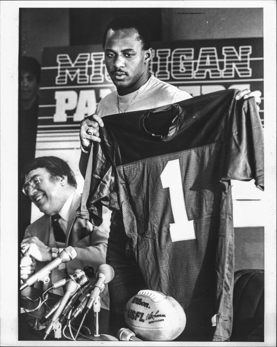 Michigan Panthers receiver Anthony Carter shows his No. 1 jersey.