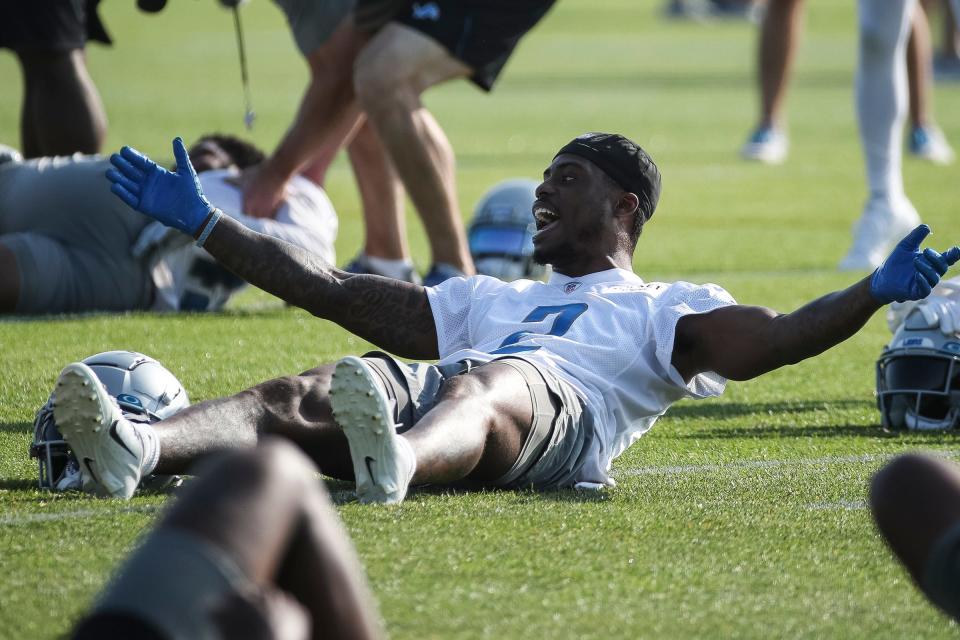 Detroit Lions safety C.J. Gardner-Johnson (2) talks to teammates during warmups for training camp at the Detroit Lions practice facility in Allen Park on Monday, July 24, 2023.