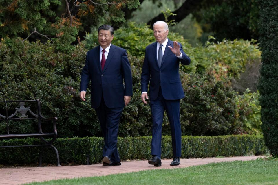 US President Joe Biden (R) and Chinese President Xi Jinping walk together after a meeting during the Asia-Pacific Economic Cooperation (APEC) Leaders' week in Woodside, California on November 15, 2023. Biden and Xi will try to prevent the superpowers' rivalry spilling into conflict when they meet for the first time in a year at a high-stakes summit in San Francisco on Wednesday. With tensions soaring over issues including Taiwan, sanctions and trade, the leaders of the world's largest economies are expected to hold at least three hours of talks at the Filoli country estate on the city's outskirts. (Photo by Brendan Smialowski / AFP) (Photo by BRENDAN SMIALOWSKI/AFP via Getty Images)