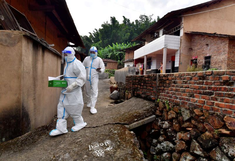 FILE PHOTO: Medical workers conduct nucleic acid tests for elderly residents at a village, following new cases of the coronavirus disease (COVDI-19), in Fujian