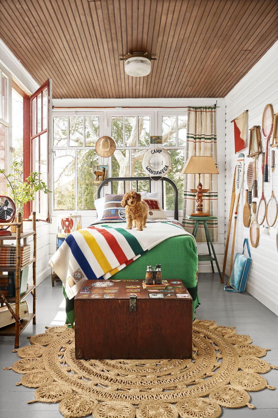 <p>In this colorful and collected sunroom-turned-nostalgia-rich sleeping porch at Wisconsin's Camp Wandawega, durable painted floors (<a href="https://www.valsparpaint.com/en/find-the-right-product/interior/paint/oil-porch-and-floor-paint.html" rel="nofollow noopener" target="_blank" data-ylk="slk:Light Gray Oil Porch & Floor Paint by Valspar;elm:context_link;itc:0;sec:content-canvas" class="link ">Light Gray Oil Porch & Floor Paint by Valspar</a>) hold up to the great outdoors. </p>