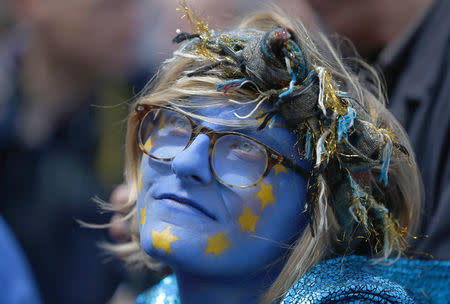 A woman wears paint on her face during a 'March for Europe' demonstration against Britain's decision to leave the European Union, in central London, Britain July 2, 2016. Britain voted to leave the European Union in the EU Brexit referendum. REUTERS/Neil Hall