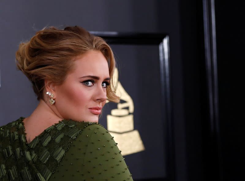 FILE PHOTO: Singer Adele arrives at the 59th Annual Grammy Awards in Los Angeles