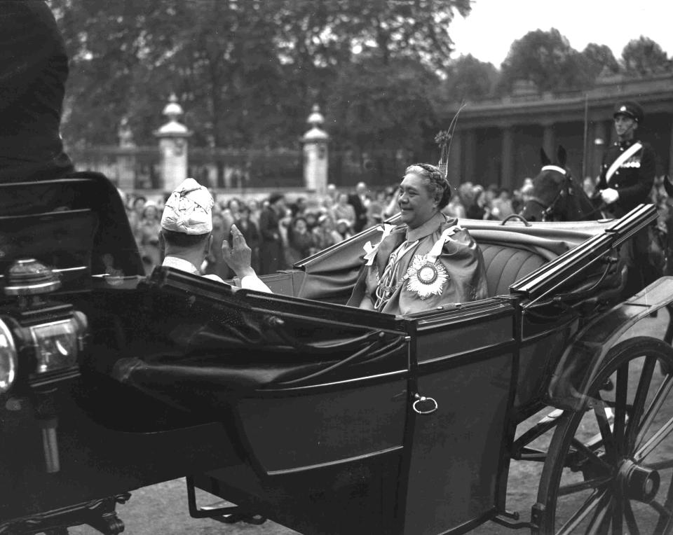 FILE - A carriage carrying Queen Salote Tupou III of Tonga forms part of the coronation procession from Buckingham Palace to Westminster Abbey where the coronation of Britain's Queen Elizabeth II will take place. London, June. 2, 1953. As well as celebrating Queen Elizabeth II’s Platinum Jubilee, Tonga’s High Commissioner Titilupe Fanetupouvava’u Tu’ivakano will also remember her great- grandmother Queen Salote Tupou III, who endeared herself to Britons as she rode through the streets of London in an open carriage during Elizabeth’s coronation parade in 1953. (AP Photo, File)