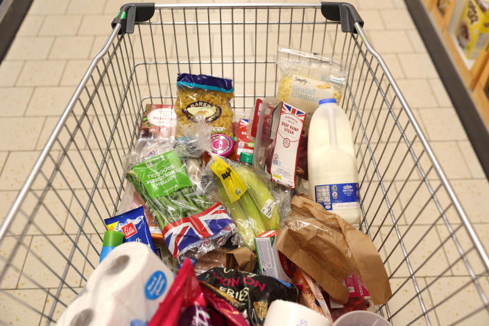 inflation  NEWCASTLE-UNDER-LYME, ENGLAND - NOVEMBER 14:  A shopping trolley is filled with groceries at a Lidl supermarket store on November 14, 2022 in Newcastle Under Lyme, England. (Photo by Nathan Stirk/Getty Images)