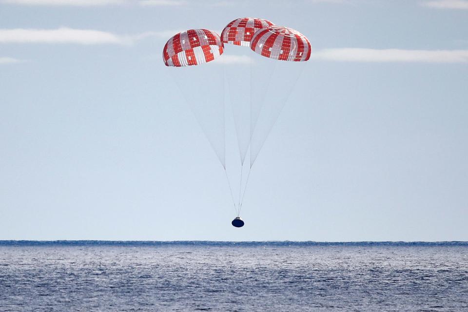 NASA's Orion Capsule splashes down after a successful un-crewed Artemis I Moon Mission on December 11, 2022 seen from aboard the U.S.S. Portland in the Pacific Ocean off the coast of Baja California, Mexico.