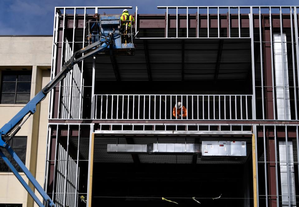 Workers build a dormitory at Hardin-Simmons University.