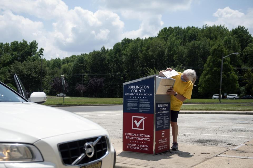 A Burlington County voter casts a ballot for last year's June primary election in one of many drop boxes around the county.
(Photo: JOE LAMBERTI / COURIER-POST)