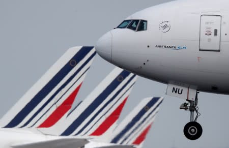 FILE PHOTO: An Air France Boeing 777-300 airplane lands at the Charles-de-Gaulle airport in Roissy