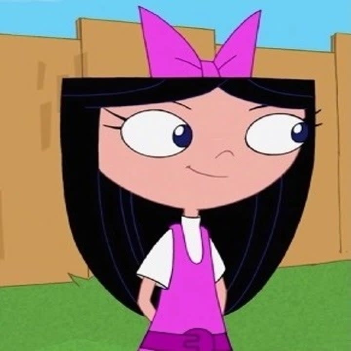 Isabella from Disney's Phineas and Ferb standing with a slight smile and her hands behind her back.