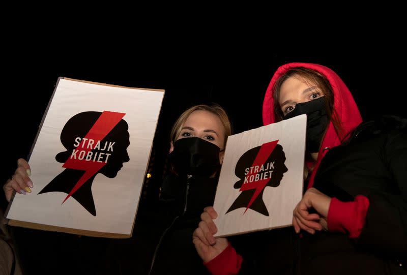 FILE PHOTO: Women hold placards as they take part in a protest against the ruling by Poland's Constitutional Tribunal that imposes a near-total ban on abortion, in Gdansk