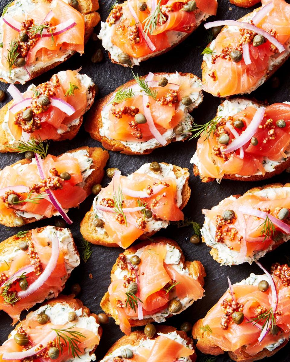 crostini topped with cream cheese, smoked salmon, red onion and capers