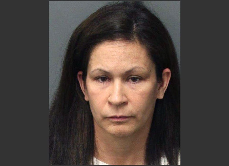 This photo released by the Riverside Police Dept. shows Andrea Michelle Cardosa, 40, who was arrested on Monday, Feb. 3, 2014 in Perris, Calif. Cardosa a former Southern California educator was jailed on felony charges that could send her to prison for life after a former female student accused her of sexual abuse in a YouTube video that's gained nearly a million views and prompted another girl to come forward. (AP Photo/Riverside Police Dept.)