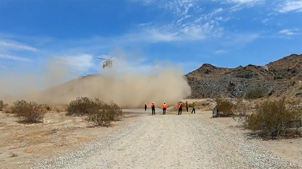 First responders airlifted a hiker trapped on a cliff in Palm Springs, California.  / Credit: CBS News