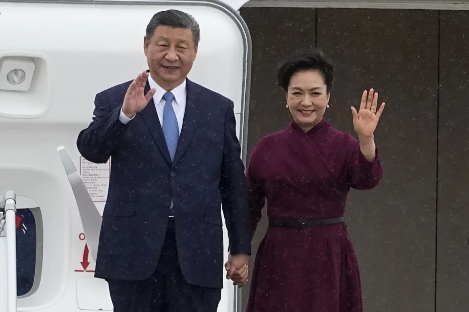 China's President Xi Jinping and his wife Peng Liyuan wave as they arrive Sunday, May 5, 2024 at Orly airport, south of Paris. French President Emmanuel Macron will seek to press China's Xi Jinping to use his influence on Moscow to move towards the end of the war in Ukraine, during a two-day state visit to France that will also see both leaders discuss trade issues. (AP Photo/Michel Euler, Pool)